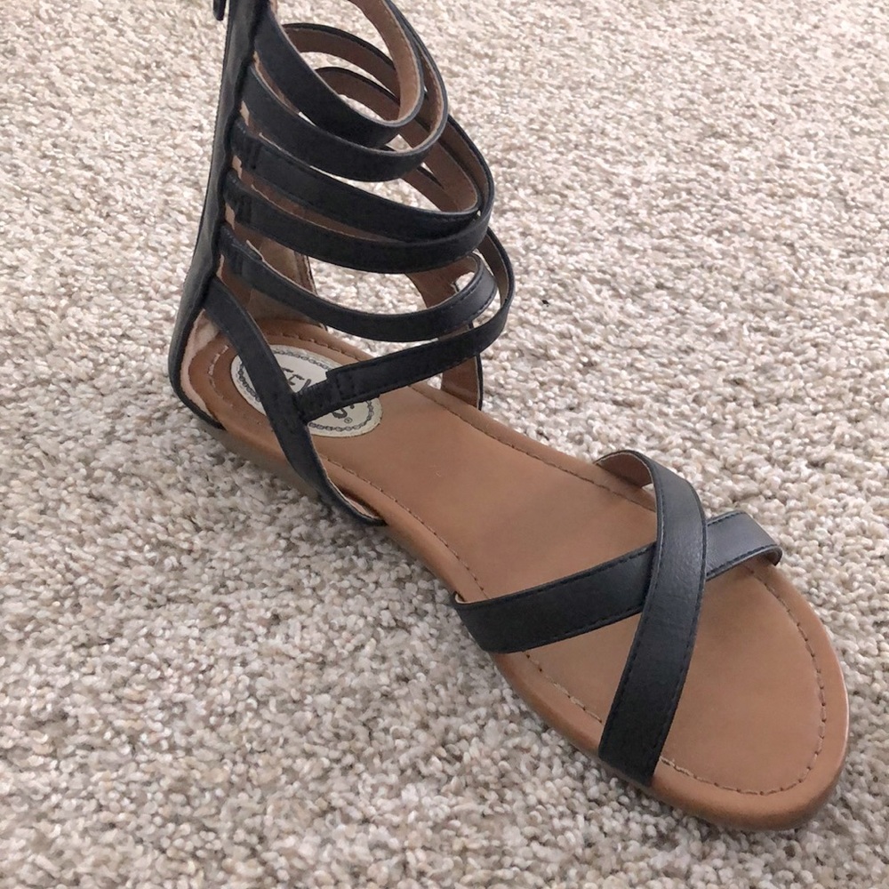 Stevie’s black gladiator sandals